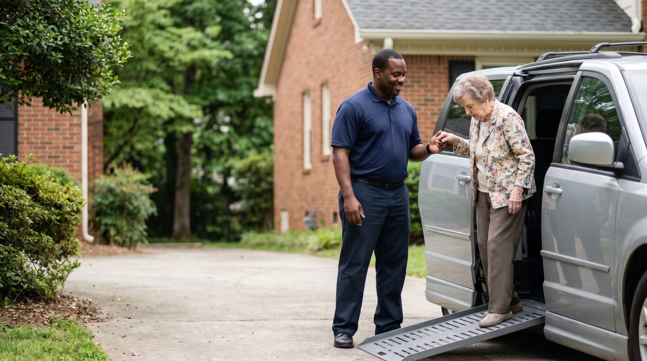 A ProVital Transit driver helping a client out of a wheelchair-accessible van